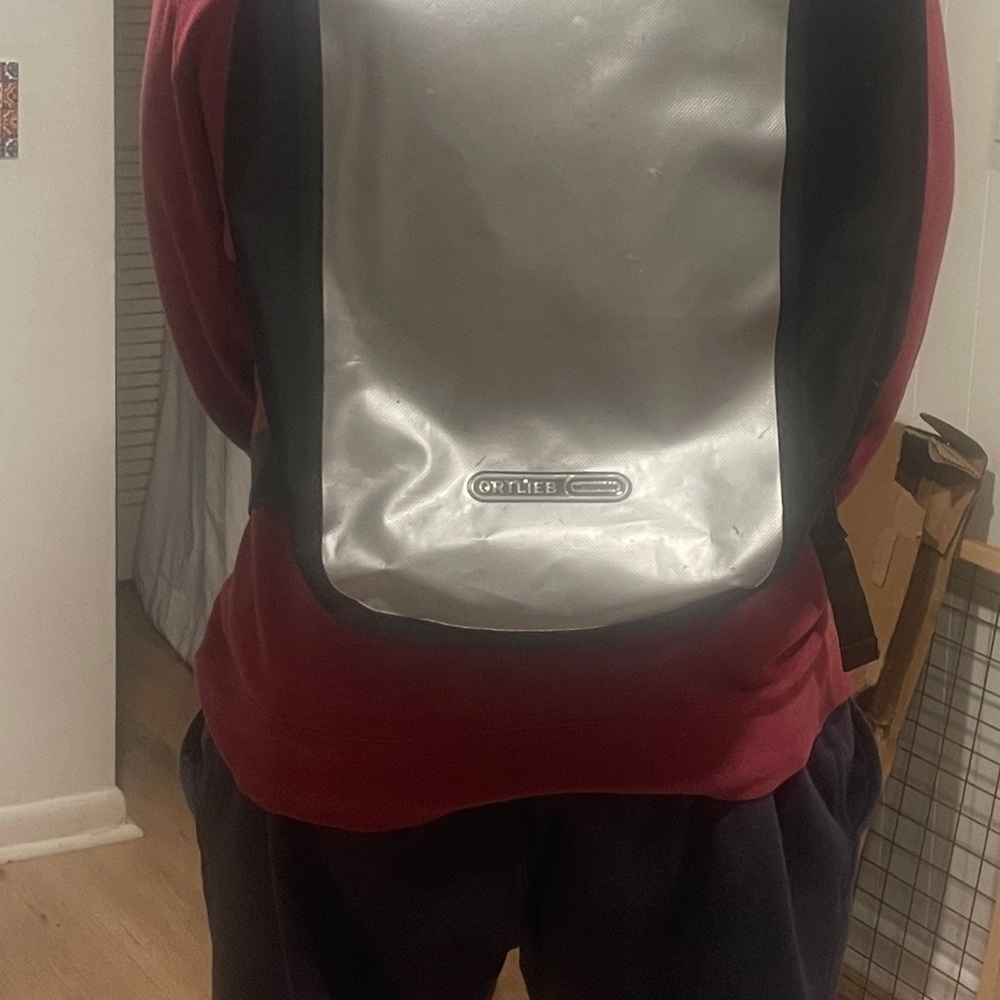 Ortlieb Waterproof Silver and Black backpack.